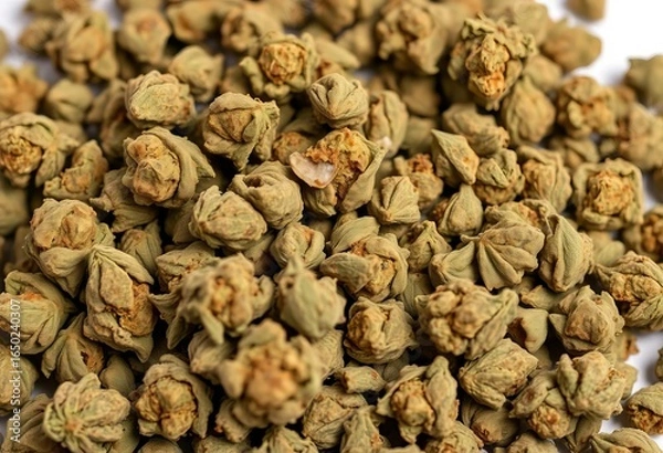Fototapeta A haphazard pile of dried cannabis buds, varying in size and shade of green,  sativa,  substance