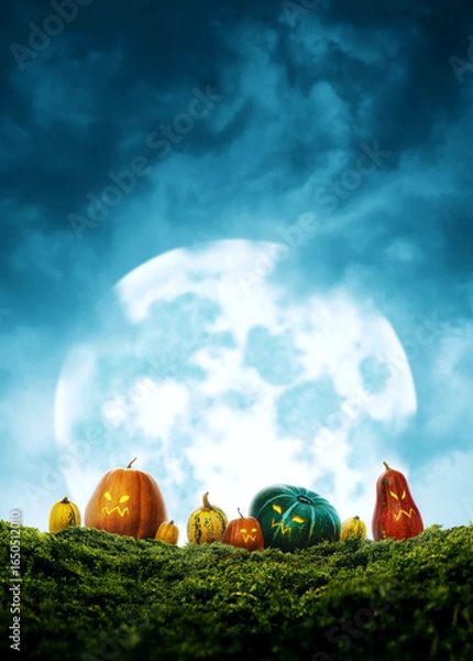 Obraz Cute colorful halloween pumpkins on grass and massive moon