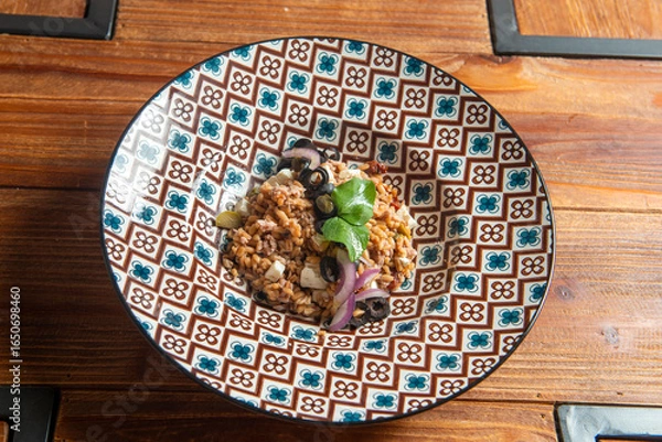 Fototapeta Fresh Mediterranean Greek Farro Salad with Olives, Tomatoes, Carrots, Feta Cheese and Farro, Asparagus and Artichokes