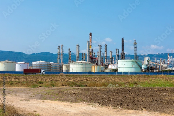 Obraz Industrial refinery park with mountain in the background