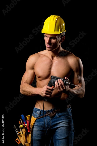 Obraz fit shirtless worker with drill and tools