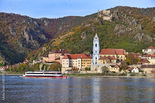 Fototapeta Panorama of Durnstein with ship on Danube river in Lower Austria, Austria,autumn season