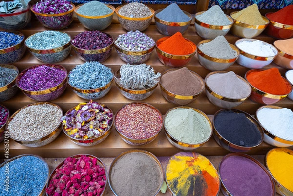 Obraz Traditional spices market. Pots and wooden tubs stand in row with colorful tea, spices, fruits, roots, flowers. Street bazaar. Dubai, UAE. Top view