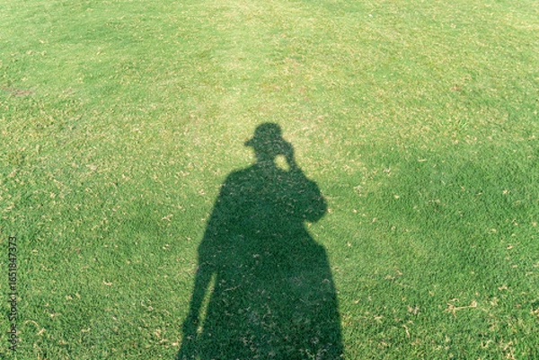 Obraz 芝生に映る人の影