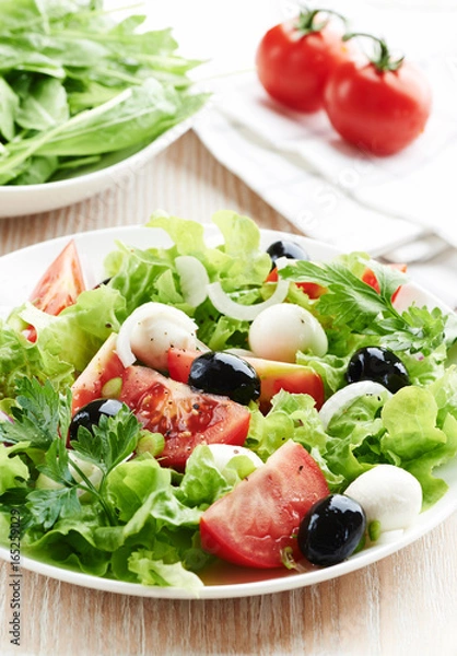 Fototapeta Mediterranean-style salad with mozzarella