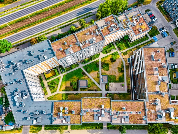 Obraz Drone photography of apartment complex rooftop during summer day