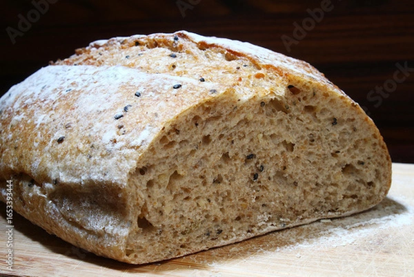 Fototapeta Artisan bread under dramatic light. Brazilian breakfast.