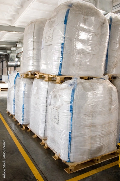 Fototapeta White large containers for bulk material on pallets