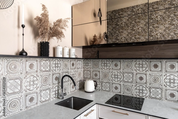 Fototapeta Close-Up of Stylish Kitchen Counter with Patterned Tiles