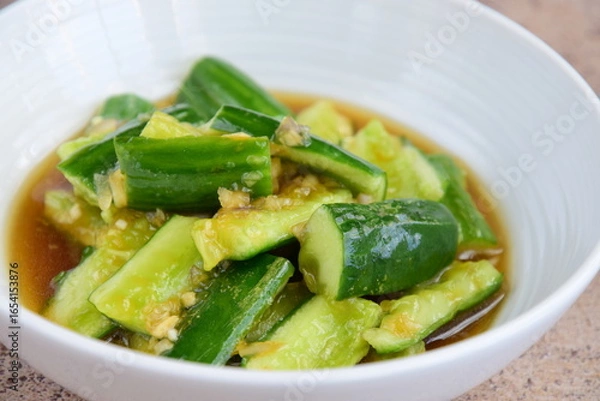 Fototapeta Asian crushed cucumber salad with garlic, soy sauce and sesame oil