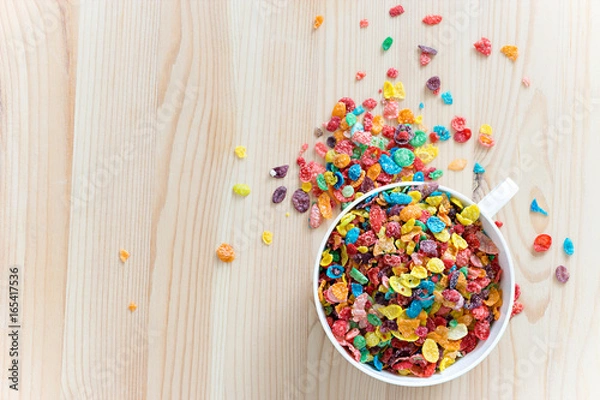 Obraz Kids healthy quick breakfast. Colorful rice cereal on wooden background. Copy space