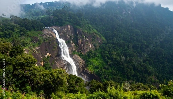 Obraz Waterfall cascading down rocky mountainside (1)