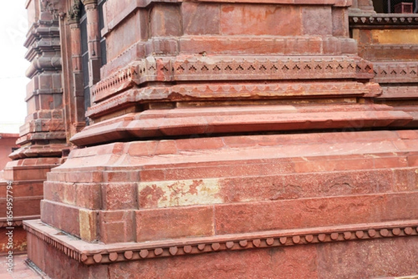Fototapeta ancient Indian temple arches fragment,The sacred building carved from stone, Ancient rock curved temples of Hindu Gods at vrindavan