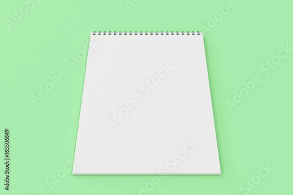 Fototapeta Blank white notebook with metal spiral bound on green background