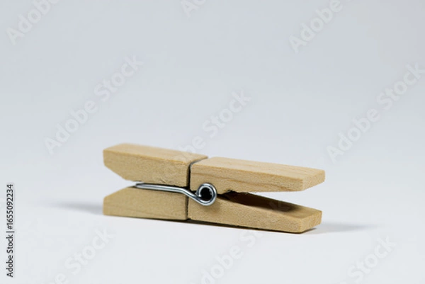 Obraz a wooden peg with a metal hook on a white background