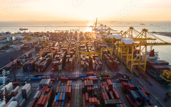 Obraz container ship in import export and business logistic.By crane ,Trade Port , Shipping.cargo to harbor.Aerial view.Water transport.International.Shell Marine.Top view.