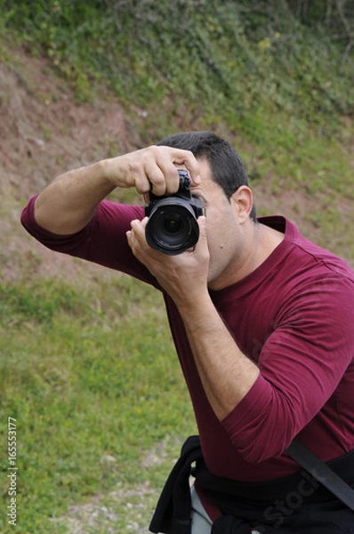 Fototapeta ein mann fotografiert 