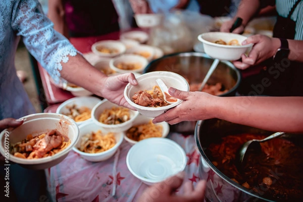 Fototapeta Help with feeding homeless people to alleviate hunger. poverty concept