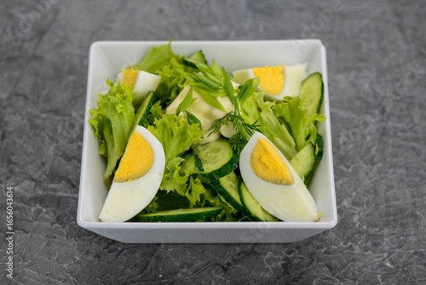 Fototapeta salad greens cucumber and boiled egg