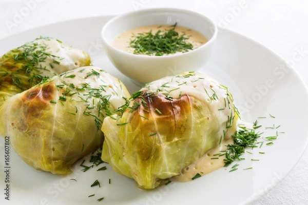 Fototapeta lahanodolmathes with broth based sauce and dill