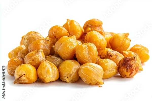 Fototapeta Golden roasted chickpeas piled together on a white background ready for snacking or cooking in diverse dishes