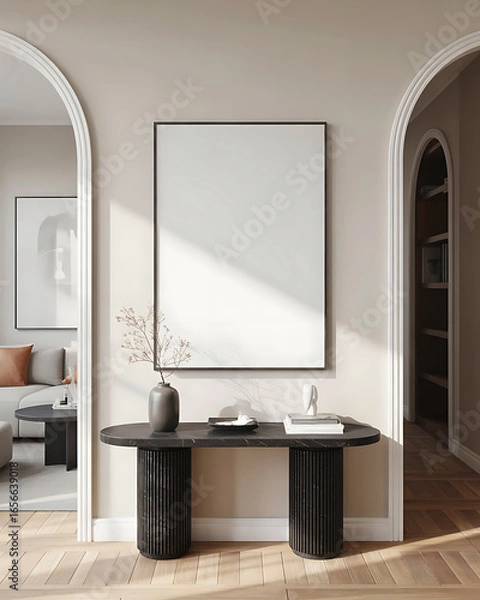 Fototapeta Modern entryway with a large blank canvas artwork above a dark console table with vases