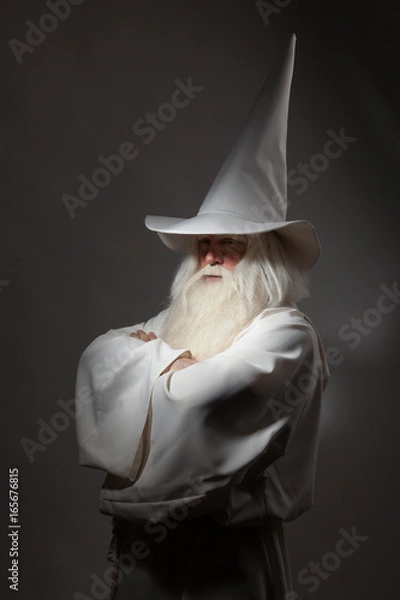 Obraz A man in a sorcerer costume on a black background