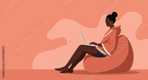 Fototapeta Woman comfortably using a laptop on a beanbag chair, illustrating remote work, flexible learning, and modern digital lifestyle.