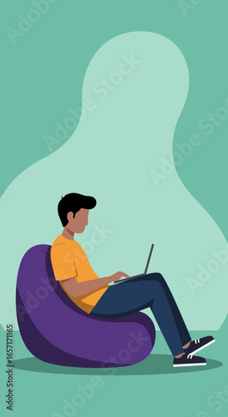 Fototapeta Young person comfortably working on a laptop from a bean bag chair. Ideal for remote work, online learning, or modern digital lifestyle concepts.