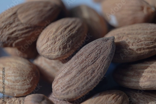 Obraz almonds on a wooden table