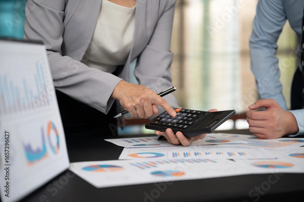 Obraz Financial Advisor team working analysis on business report for estimating the capital, planning corporate finance and financial management.