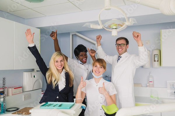 Fototapeta team dentists in the clinic with manager