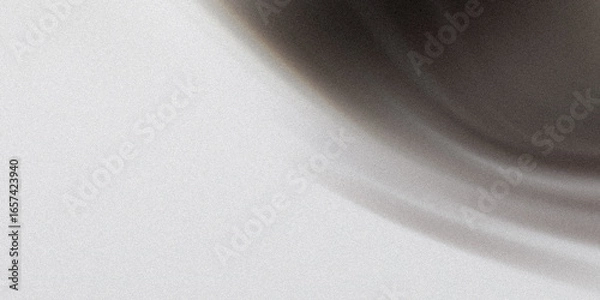 Fototapeta A blurred dark gradient with a circular shape creates an abstract and modern background with a smooth, grainy texture