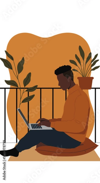 Fototapeta Black man working remotely on a laptop from a comfortable balcony setup with plants, illustrating modern work-life balance and flexible living.