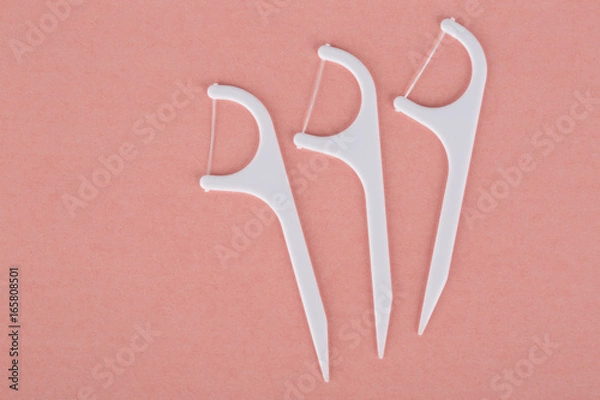 Fototapeta Close up of dental floss toothpicks