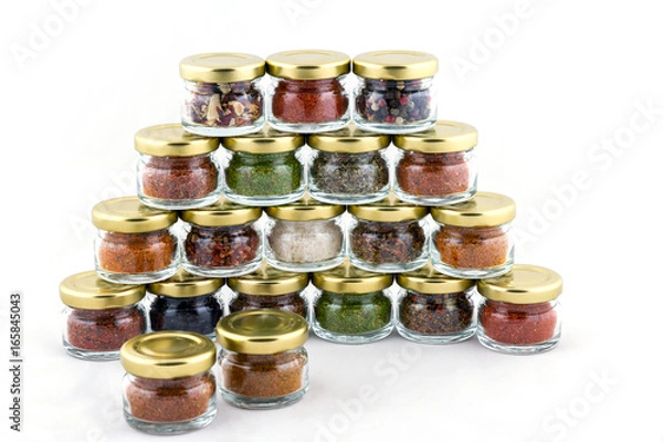 Fototapeta A set of spices in small glass jars
