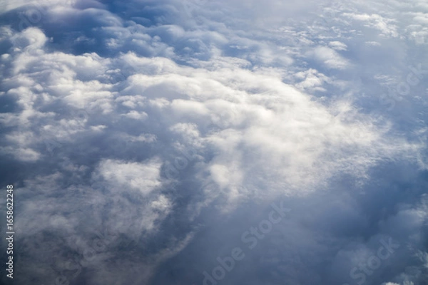 Fototapeta Textured clouds high in the sky.