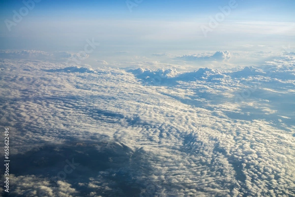 Fototapeta Textured clouds high in the sky.