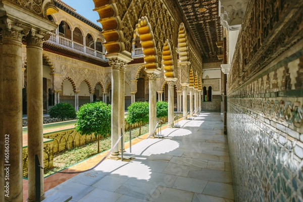 Obraz Palace of Alcazar, Famous Andalusian Architecture. Old Arab Palace in Seville, Spain. Ornamented Arch and Column. Famous travel destination.