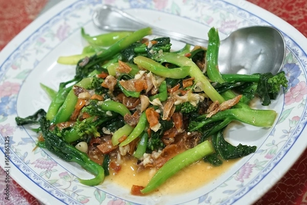 Obraz Stir fried chinese Kale with salted fish and dried squid. (With selective focus)