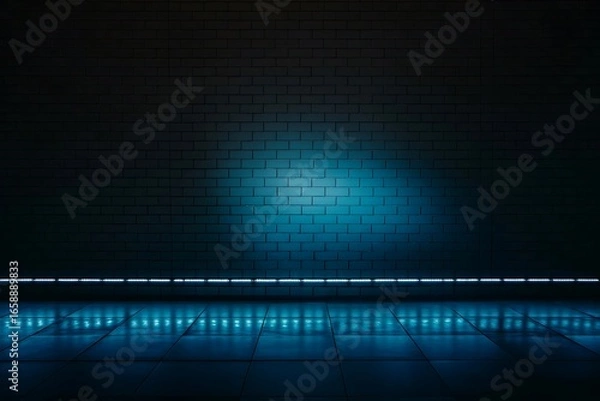 Fototapeta A dark room with a brick wall and a shiny floor illuminated by a strip of bright blue lights