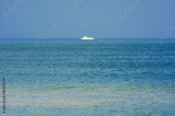 Obraz Beautiful seascape. Ship on the horizon on a background of blue sky