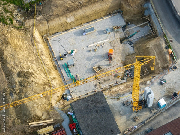 Obraz Aerial view of construction site in Switzerland. Crane for building a new house.