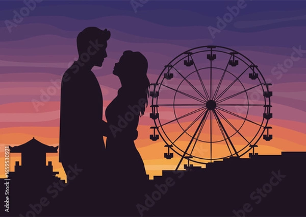 Fototapeta Silhouette of a man and woman, couple in love embracing during sunset, standing by a ferris wheel, against the backdrop of an amusement park in the evening. Romantic date concept for greeting card.
