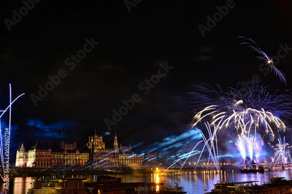 Fototapeta bright and colorful fireworks over the Danube in Budapest, Hungary on the 20th of August, 2025. holiday celebration. cultural and religious event 