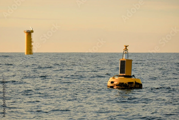 Fototapeta Marine Data Buoy with Solar Panel and Offshore Wind Farm Monopile Transition Piece,  Wind Farm Construction Survey