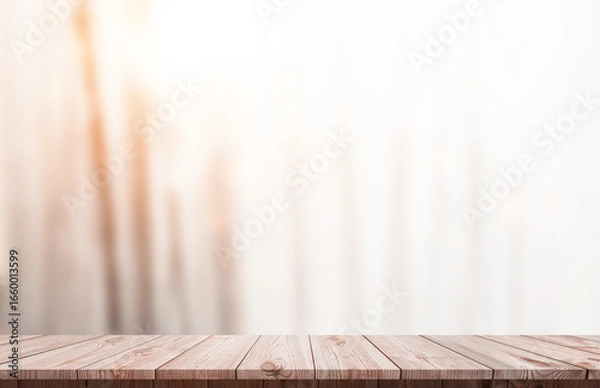 Fototapeta Wooden table with blurred light background, perfect for product displays, food photography, or showcasing home decor in a cozy setting.