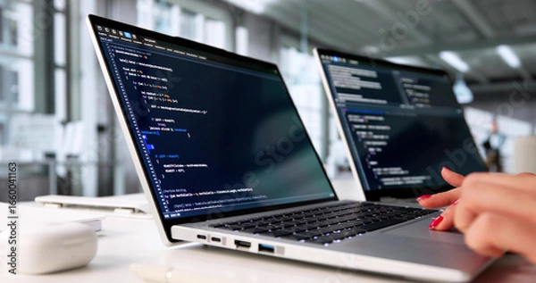 Fototapeta Young Woman Coding Software In Office