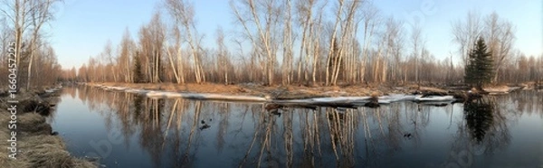 Fototapeta Tranquil river reflecting a winter's edge.