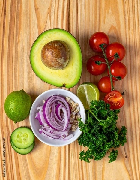 Fototapeta Top View Still Life of Fresh Avocado, Quinoa, Cherry Tomatoes, Red Onion, Cucumber, Lime, and Parsley – Healthy Salad Ingredient Composition on Natural Wood Background